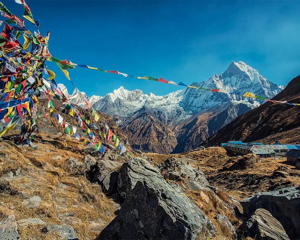 Prayer flags overlooking the snow-capped Annapurna range in Nepal