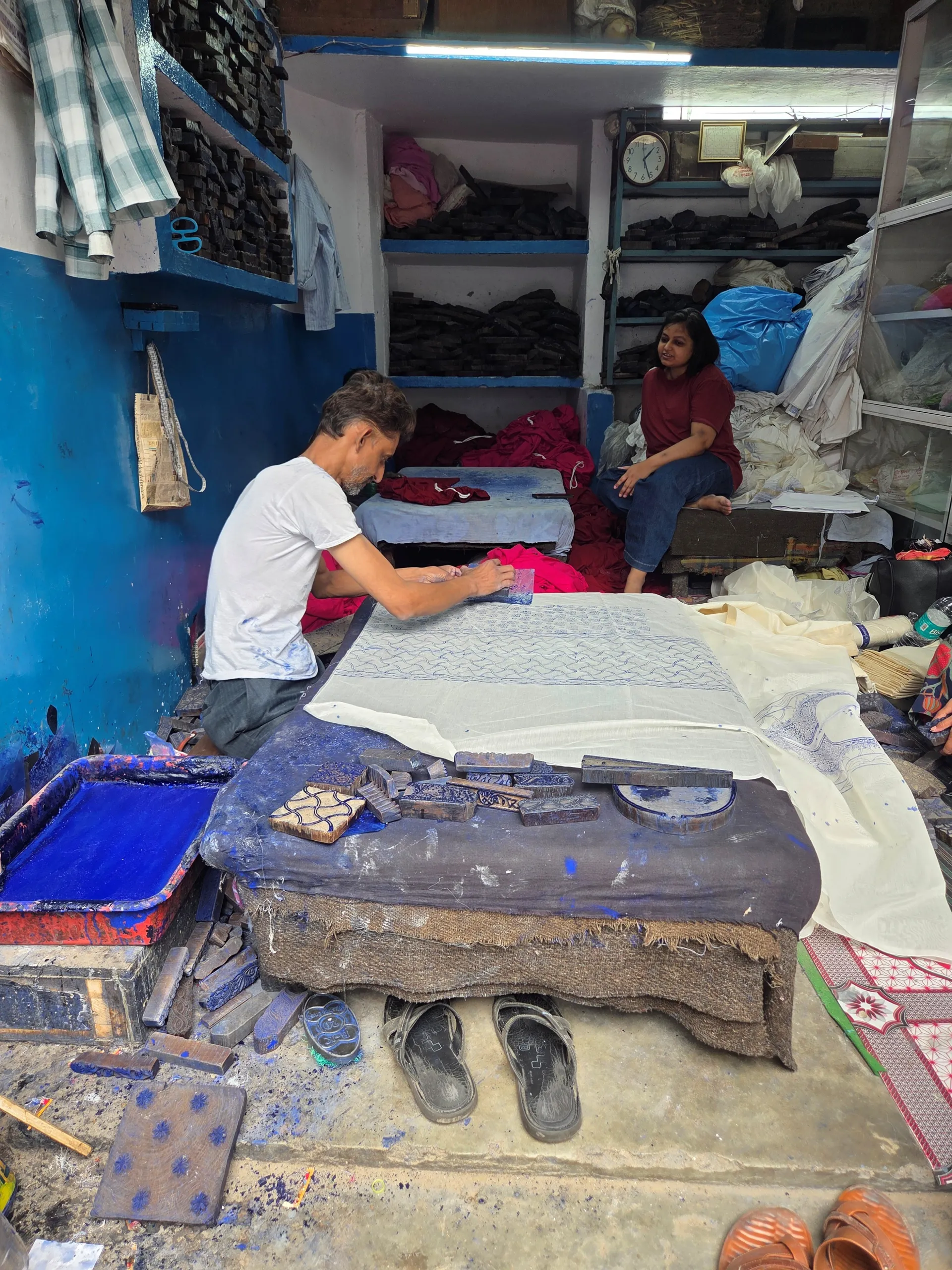 Artisan working with fabric in a Lucknow workshop