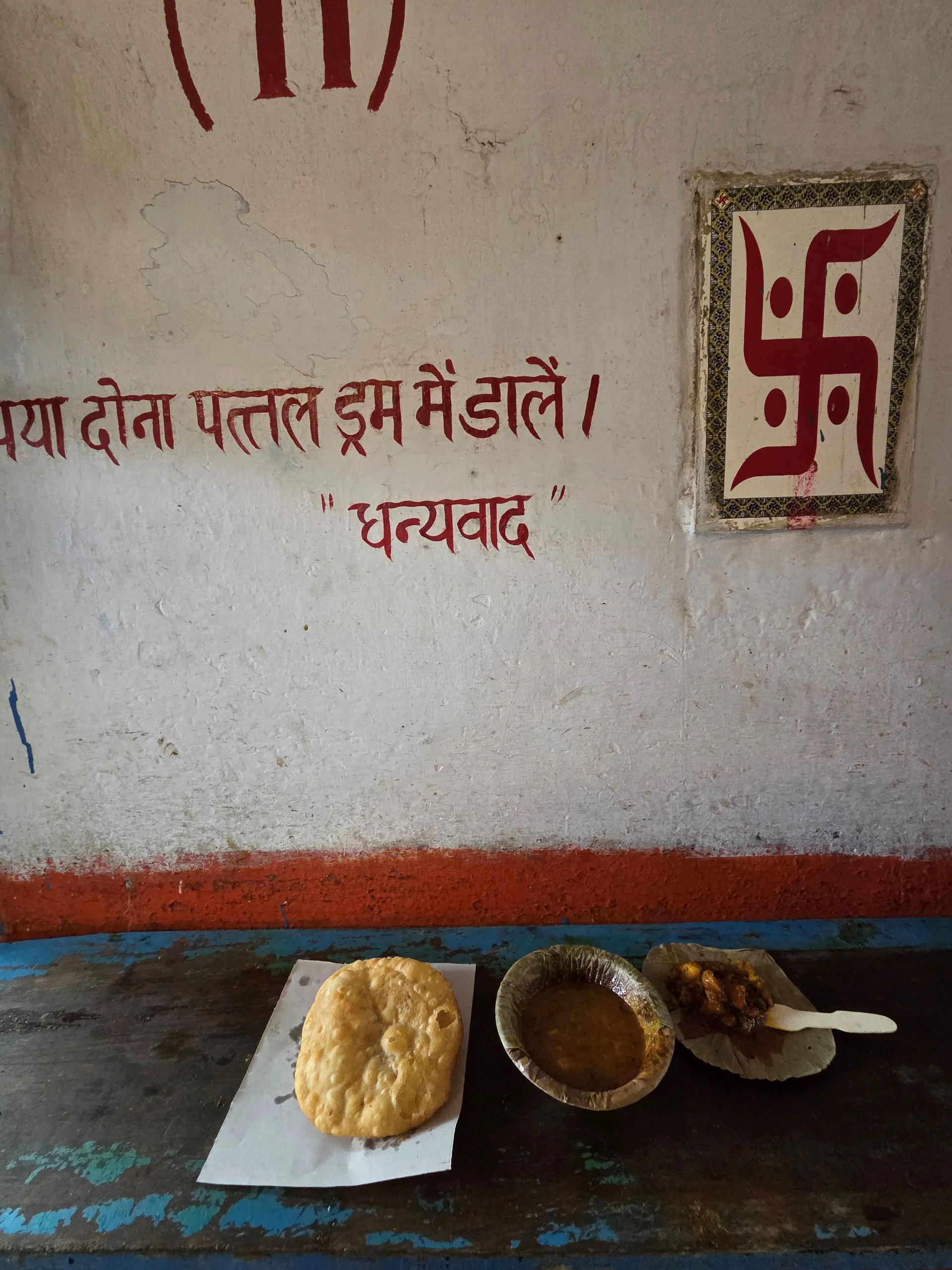A meal served on a counter at a Lucknow food stall