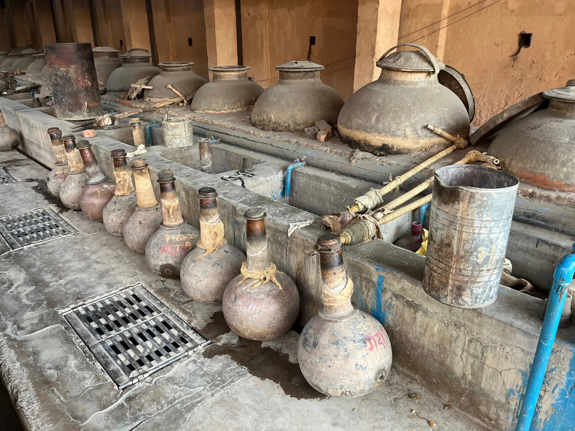 Traditional attar distilling pots and collecting vessels in Kannauj