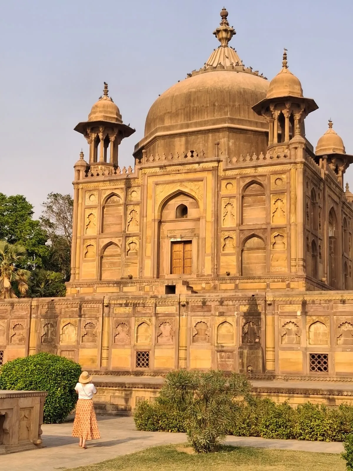 Domed sandstone monument and gardens in Prayagraj