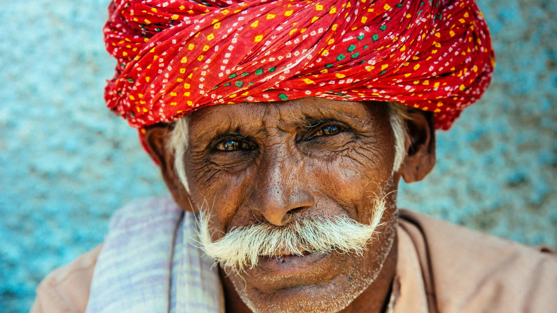 Portrait of an Indian man wearing a red Rajasthani turban