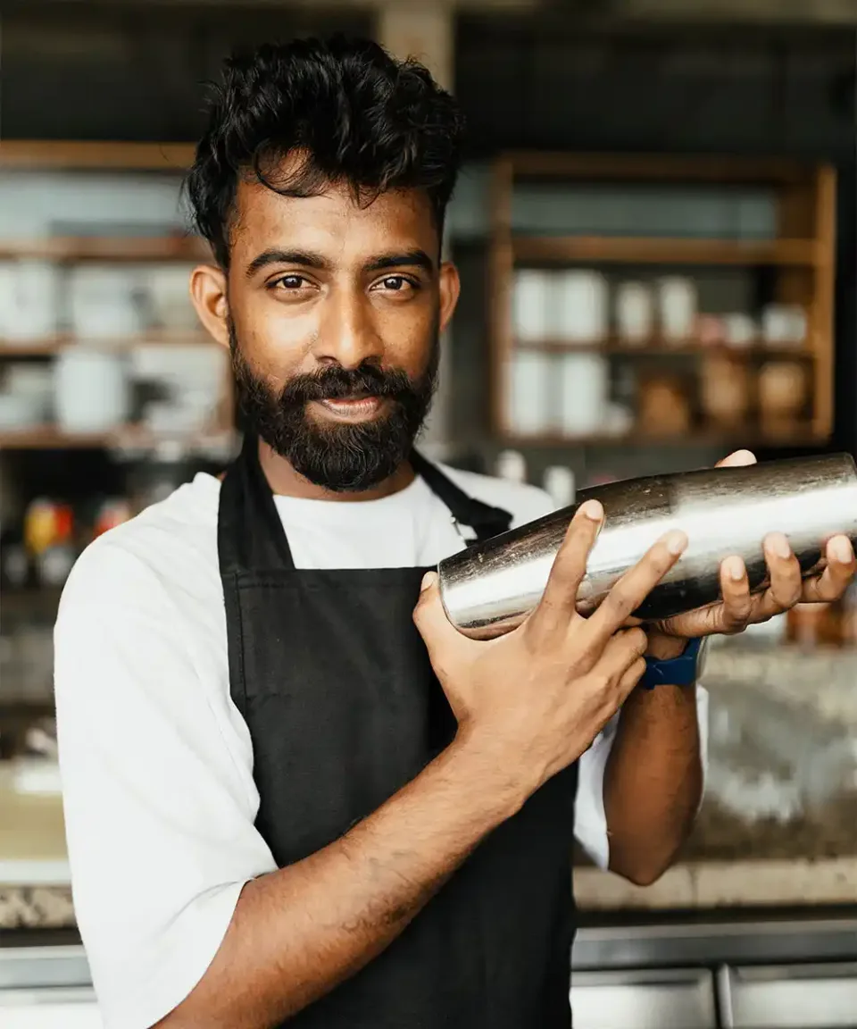 Sri Lankan bartender preparing a cocktail for guests