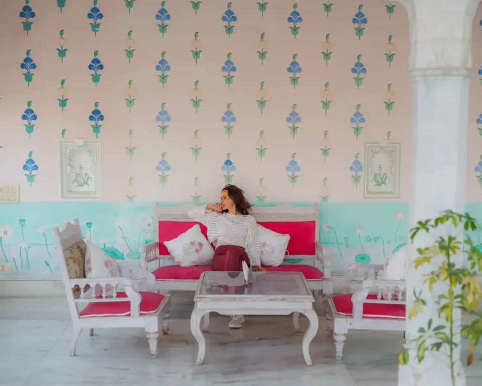 Solo traveller relaxing in a colourful boutique hotel in India