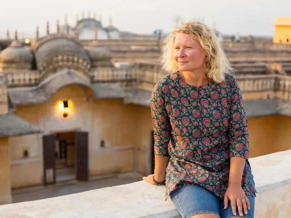 Solo traveller overlooking historic Jaipur architecture
