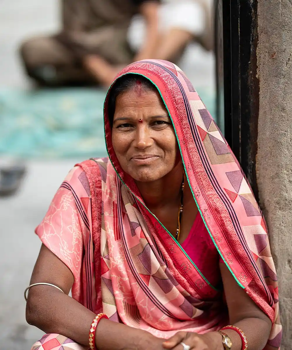 Portrait of a woman wearing a pink sari in India